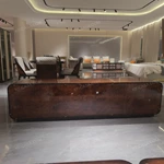 Refined TV Stand with Quilted Upholstered Panels, Natural Wood Veneer Finish and Brushed Stainless Steel Handles